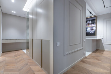 Modern interior design with elegant finishes and elegant lines in a stylish hallway and adjacent room.
