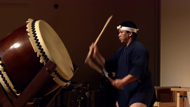 Japanese musician playing a traditional taiko drum
