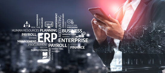 A business professional utilizes a smartphone against an urban backdrop, emphasizing the importance of ERP solutions and payroll systems in modern enterprise operations. Tessel