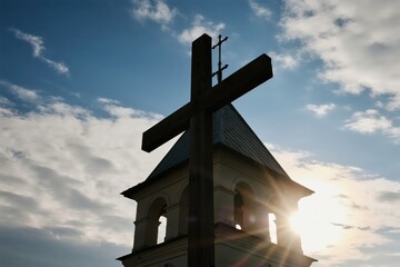 Cross Against Cloudy Sky