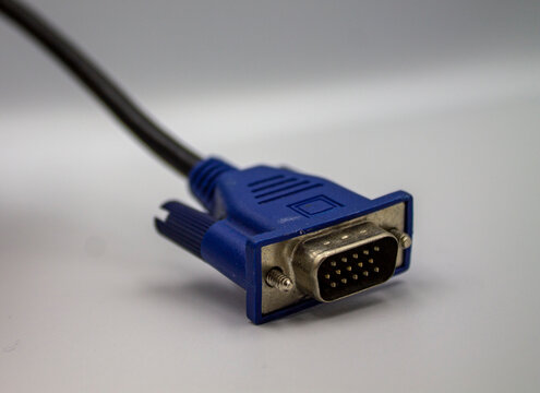 Blue VGA connector tilted on a white background