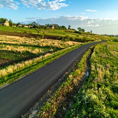 Naklejka premium Winding road through rural landscape