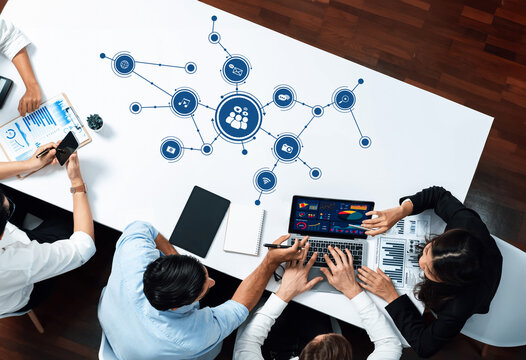 Innovative teamwork and technology integration are showcased in this office environment, highlighting data analysis and collaboration among professionals striving for efficiency. Amity