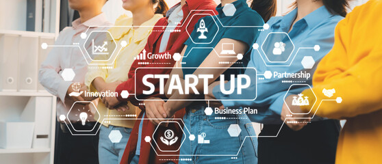 Obraz premium A diverse team discusses plans for a startup, surrounded by digital icons symbolizing growth, innovation, and business strategy in a modern office environment. Amity