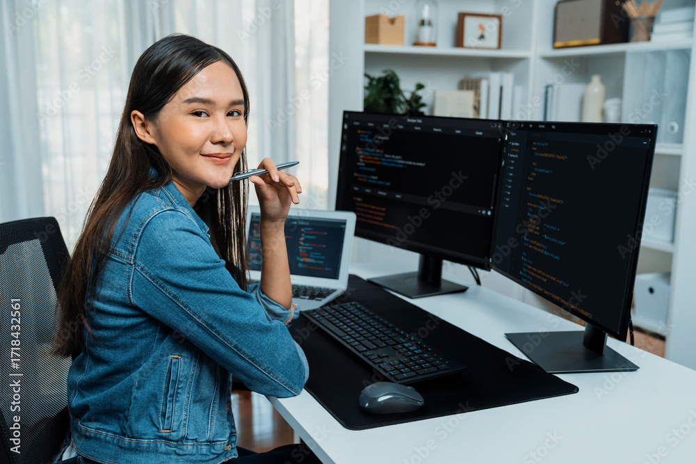 Wall mural young asian in it developer looking at camera to present with online information on pc with coding p