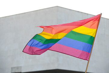 LGBT flag. The LGBTIQ flag is flying. March in protest. Colorful parade celebrating LGBTI rights.  Symbol of lesbian, gay, bisexual, transgender. 