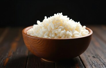Bowl of white rice, emphasizing nutritional value, organic nature. Steamed grains, simple meal, ready-to-eat staple. Asian cuisine, Japanese food, Chinese culture connection. Healthy eating, dieting,
