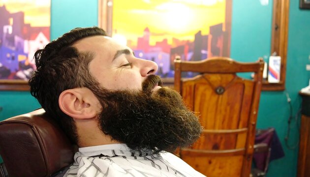 Man with beard resting in barber chair