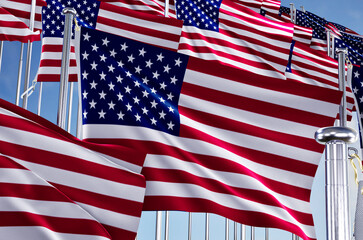 united states of america many flags in row waving together on blue cloudy sky,