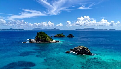 Fototapeta premium Turquoise islands in a vibrant blue sea