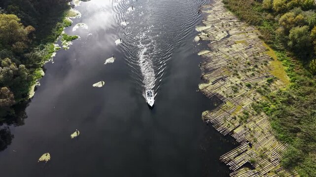 Aerial Bydgoszcz Poland boat Brda river log raft. Northern Poland. River Brda inland waterway, tributary Vistula. Host to international regatta rowing competition. Recreation, fishing, transportation.