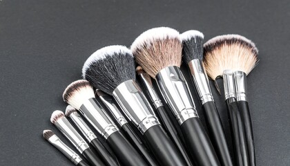 Makeup brushes on dark surface