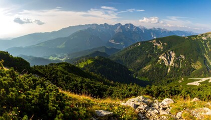 Naklejka premium Panoramic mountain vista, lush valleys, and rolling hills