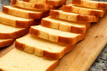Closeup of Bread Slices on Wooden Cutting Board