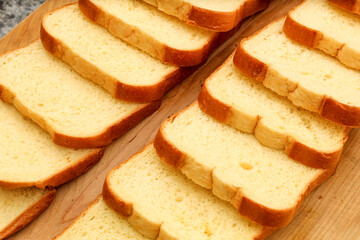 Closeup of Bread Slices on Wooden Cutting Board
