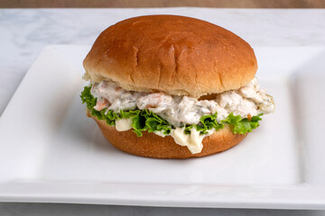 shrimp seafood salad 0n a hamburg bun