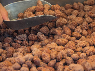 Sugar-Coated Nuts at a Vibrant Fairground Stand