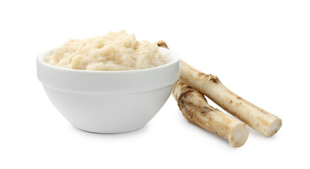 Tasty horseradish sauce in bowl and roots isolated on white