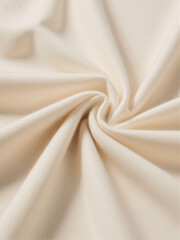 close up of white beige folded and twisted woolen fabric background