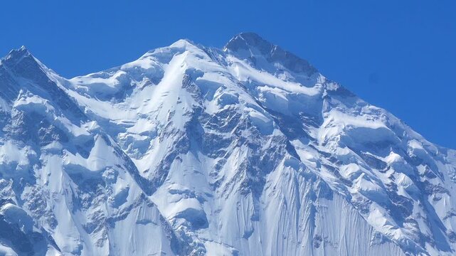 K2, also known as Mount Godwin-Austen, the world&rsquo;s second-highest mountain, located in the Karakoram Range on the border of Pakistan and China.K2 120fps Slow Motion 4K Footage of rocky mountain peak.