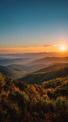 Sunrise Over Misty Mountain Ridges with Autumn Foliage Colors in Foreground