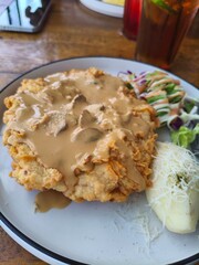 Lunch with crispy chicken steak seasoned with creamy sauce