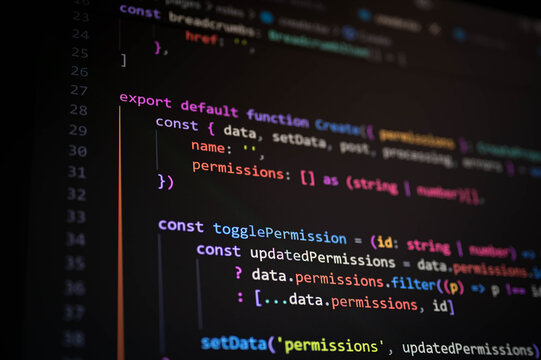 Close-up of JavaScript or TypeScript code on dark mode editor screen, showcasing software development, web app programming, and modern coding workflow in tech industry.