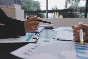 Team of business people working together in the meeting room office,
teamwork background charts and graphs banner, double exposure successful teamwork,business planning concept.