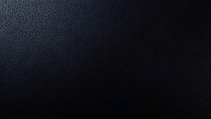 Close-up of black leather with fine grain texture, emphasizing its smooth and luxurious quality.
