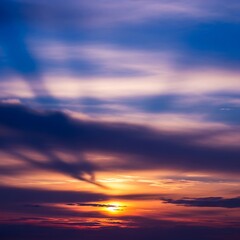 Fototapeta premium Dramatic sky with vibrant sunset colors and shadowy cloud formations