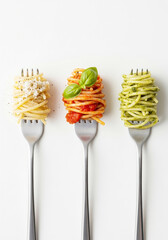 Trio of Italian pasta varieties on forks with parmesan, tomato basil, and pesto, showcasing gourmet cuisine and elegant lifestyle dining presentation
