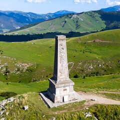 Monument on a hilltop overlooking a valley