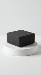 An enigmatic black cube perched gracefully a symbol of minimalist beauty and potential resting on a white platform with