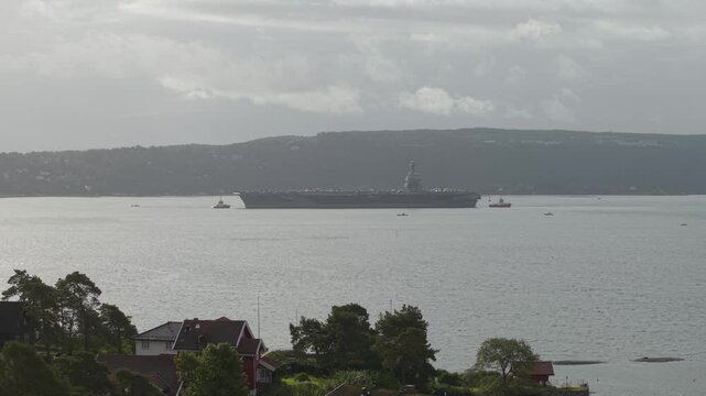 Aircraft Carrier USS Gerald R. Ford Of The United States Navy In Oslo Fjord, Oslo, Norway. - aerial shot
