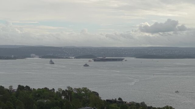 US Navy USS Gerald R. Ford (CVN-78) Aircraft Carrier Navigating in Oslo Fjord In Oslo, Norway. - aerial shot