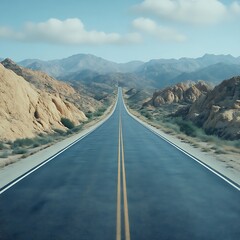 Empty road stretches into a mountain landscape