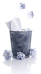 Crumpled papers in wastebasket