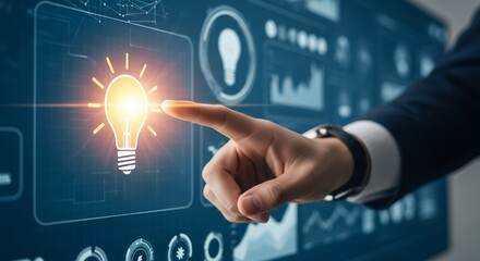 Man's hand selecting light bulb icon on a virtual interface with data graphs, concept for innovative solutions, digital transformation and strategic planning