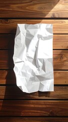 Crumpled white paper on wooden planks