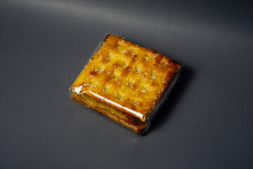 A Sugar-Sprinkled Cream Cracker or Malkist Snack Wrapped in Clear Plastic