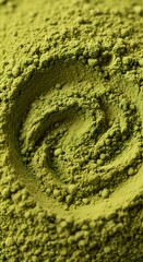 Organic Japanese matcha green tea powder background with a beautiful swirl pattern.