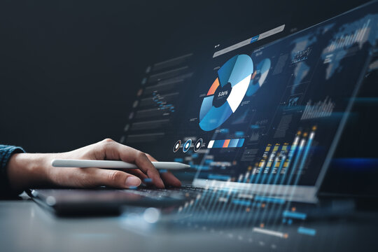 Businessman using laptop with digital data charts and graphs overlay, symbolizing financial analysis, business strategy, investment planning, and performance management. - Powered by Adobe