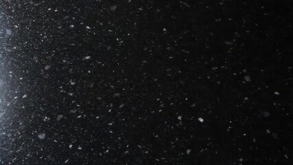 Elegant black speckled granite countertop with subtle highlights perfect for modern kitchen design and commercial projects