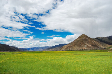 Mountain landscape with green hills and blue sky