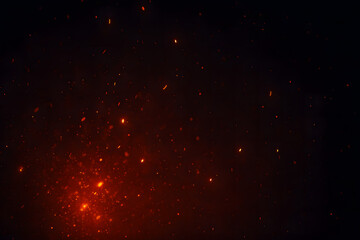 Fototapeta premium Glowing Fire Embers on Dark Background – Abstract Heat Sparks