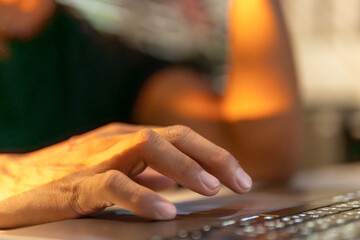 Businessman celebrating success with notebook, financial trade, and remote working lifestyle. Concept of win, congratulations, perfect achievement, succeed after hard try in modern digital work.