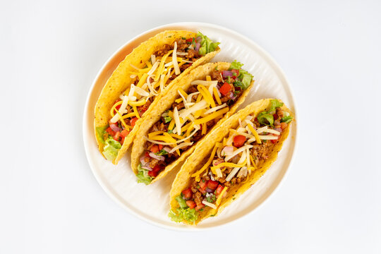 Healthy Simple Mexican tacos with chicken and vegetables  on a white background