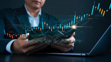 Stock market investment concept with candlestick chart and rising trend lines. Businessman using tablet and laptop to analyze financial data, trading strategy, and economic growth opportunities.