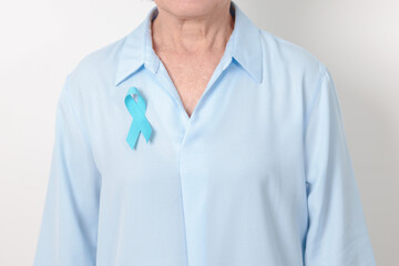 Elderly with blue Ribbon for concept of blue November, November Prostate Cancer Awareness month,...