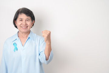 Elderly with blue Ribbon for concept of blue November, November Prostate Cancer Awareness month,...